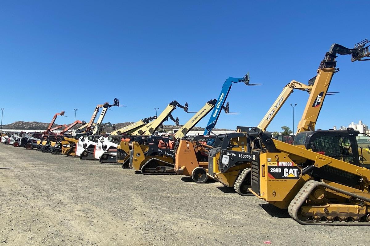 Fleet of yellow and black construction vehicles on site