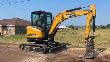 Fleet of yellow and black construction vehicles on site
