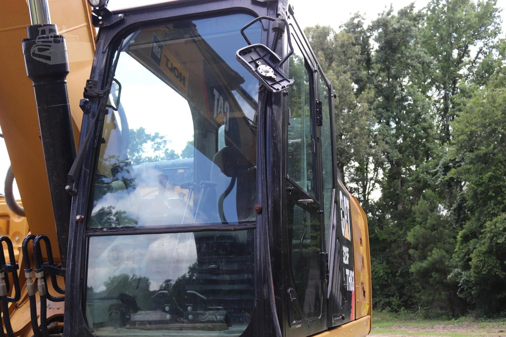 Fleet of yellow and black construction vehicles on site